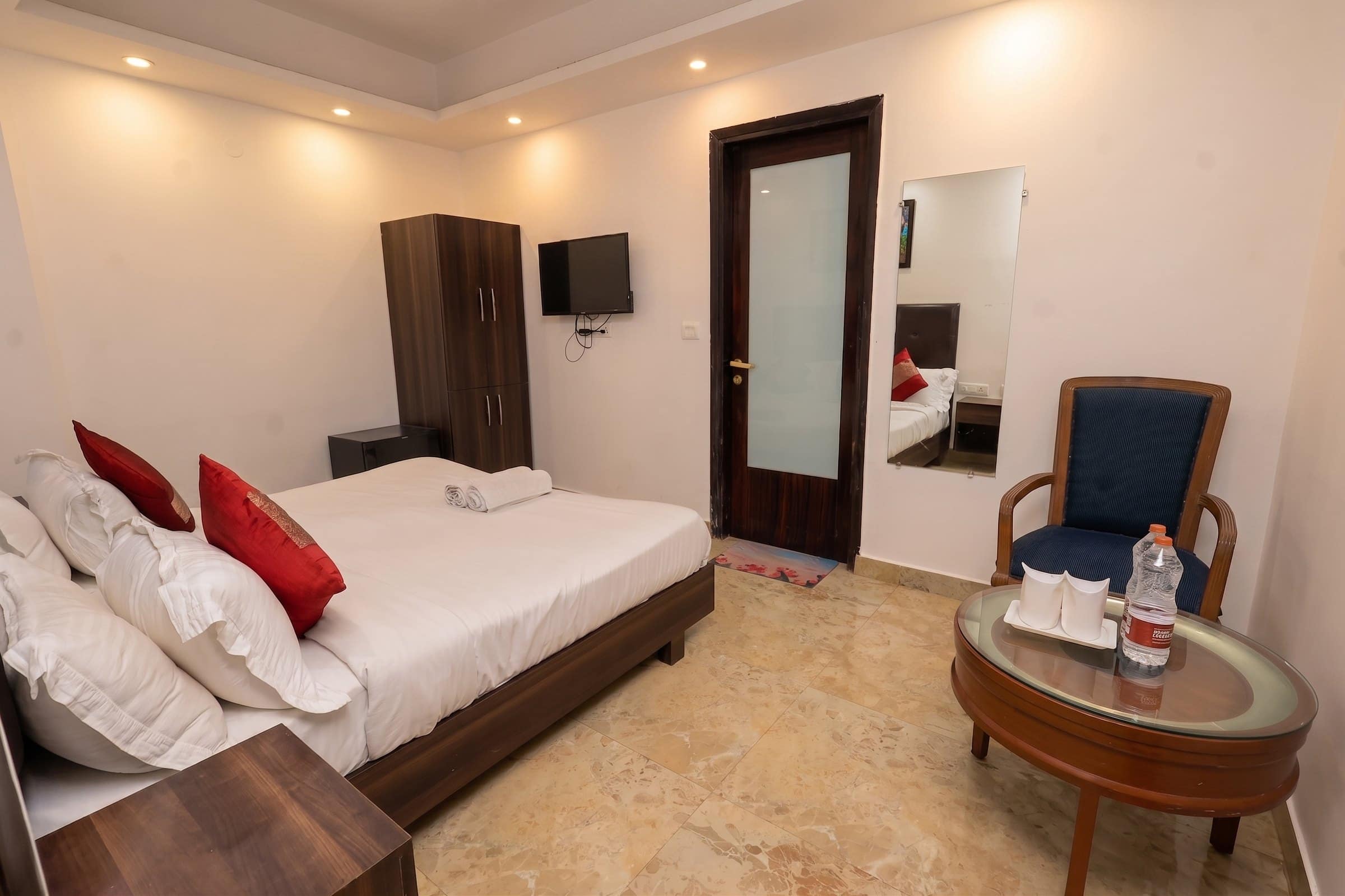 A room with a chair and a round table